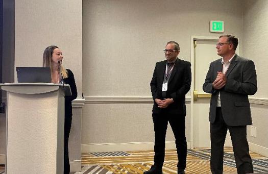 Nicole Pineault speaking at a podium.