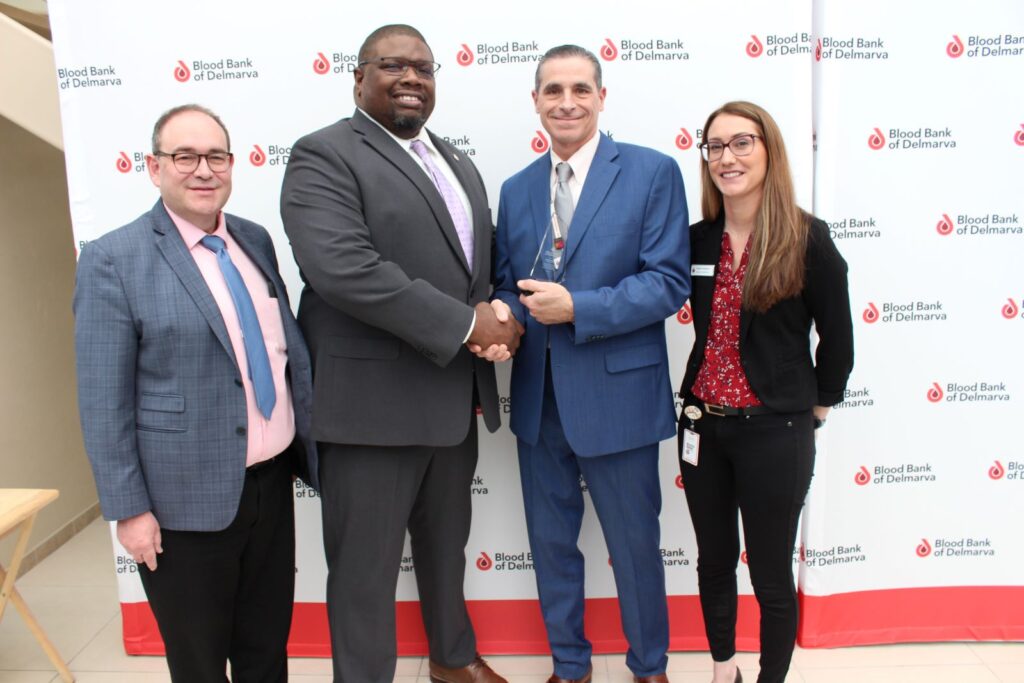 Omega Psi Phi Fraternity member William Garrett with BBD leadership at the debut of the Dr. Charles Drew Lifesaver Award.